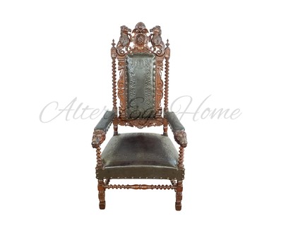 Антикварное тронное кожаное кресло с резной композицией на своде